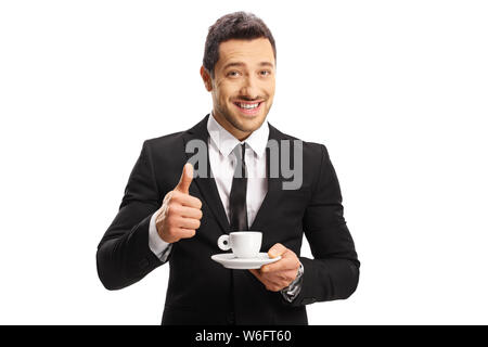 Geschäftsmann mit einer Tasse Espresso mit Daumen oben auf weißem Hintergrund Stockfoto
