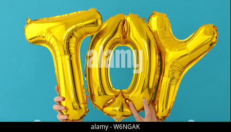 Golden TOY Worten von aufblasbaren Ballons Stockfoto