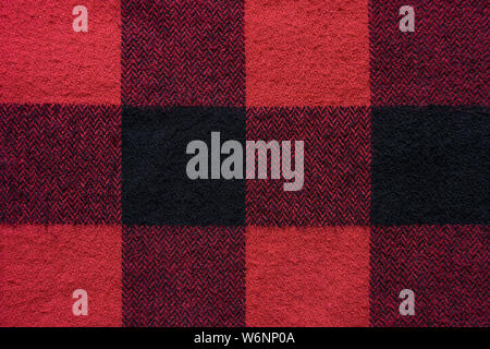 Schwarz und Grün Stoff in einem Käfig. Plaid Material. Kleidung Hintergrund Stockfoto