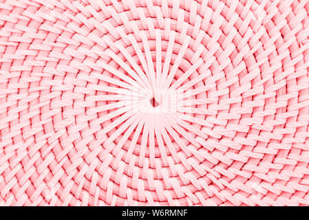 Nahaufnahme der kreisförmigen Stroh Oberfläche. Kreisförmige rose Formen. Strukturierte Oberfläche mit Kreisen. Stockfoto