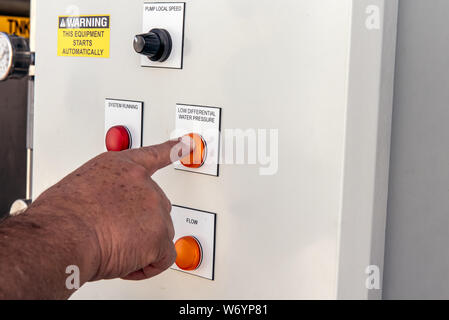 Control panel for high technology machinery has knobs to maintain safe operation by the simple push of a button. Stockfoto