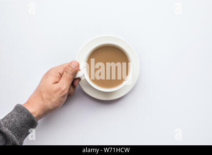 Männliche Hand, die Tasse Kaffee.Business und trinken Konzepte Stockfoto