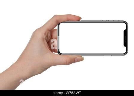 Frau Hand am Schwarz smartphone Ähnlich iphone x mit leerer Bildschirm und moderner Rahmen weniger Design - auf weißem Hintergrund Stockfoto