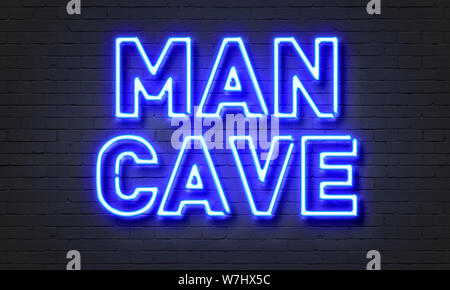 Mann Höhle Leuchtreklame auf Mauer Hintergrund Stockfoto