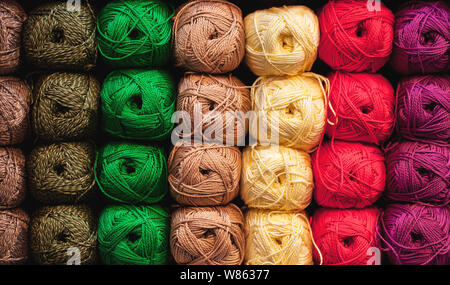 Colorful threads. Selection of colorful yarn wool on shopfront. Knitting background, a lot of balls. Knitting yarn for handmade winter clothes. Stockfoto