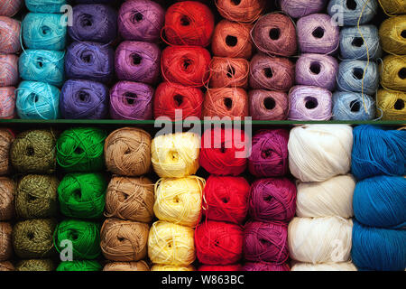 Colorful threads. Selection of colorful yarn wool on shopfront. Knitting background, a lot of balls. Knitting yarn for handmade winter clothes. Stockfoto