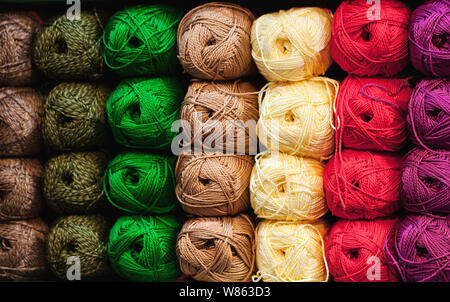 Colorful threads. Selection of colorful yarn wool on shopfront. Knitting background, a lot of balls. Knitting yarn for handmade winter clothes. Stockfoto