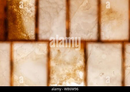 Natürliche onyx Wandpaneele mit Hintergrundbeleuchtung leuchtet, Nahaufnahme Hintergrund Foto Textur Stockfoto