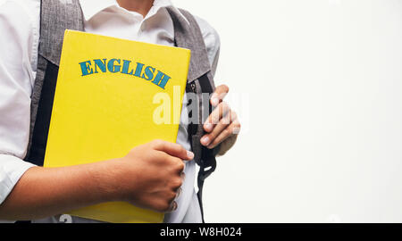 Schüler mit eine Schultasche mit einem englischen Buch closeup Stockfoto