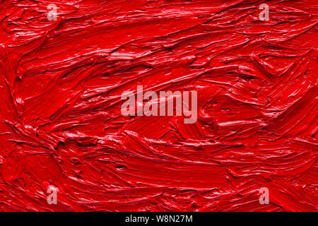 Abstrakte close-up gemalten Hintergrund. Hintergrund war mit roter Ölfarbe auf Leinwand von Hand bemalt. Stockfoto