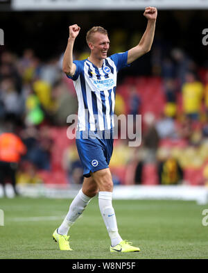 Brighton und Hove Albion Dan Brennen feiert nach der Premier League Match an der Vicarage Road, Watford. Stockfoto