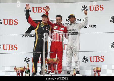 (Von links) Finnische F1 Fahrer Kimi Räikkönen von Lotus, Spanisch F1-Pilot Fernando Alonso von Ferrari und britischen F1-Pilot Lewis Hamilton Mercedes w Stockfoto