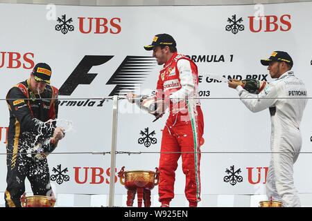 (Von links) Finnische F1 Fahrer Kimi Räikkönen von Lotus, Spanisch F1-Pilot Fernando Alonso von Ferrari und britischen F1-Pilot Lewis Hamilton Mercedes s Stockfoto