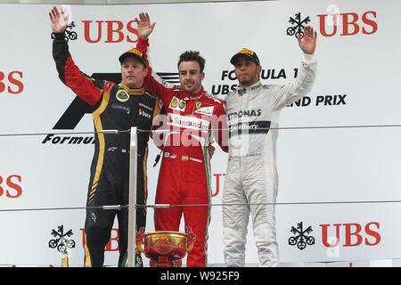 (Von links) Finnische F1 Fahrer Kimi Räikkönen von Lotus, Spanisch F1-Pilot Fernando Alonso von Ferrari und britischen F1-Pilot Lewis Hamilton Mercedes w Stockfoto