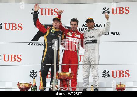 (Von links) Finnische F1 Fahrer Kimi Räikkönen von Lotus, Spanisch F1-Pilot Fernando Alonso von Ferrari und britischen F1-Pilot Lewis Hamilton Mercedes w Stockfoto
