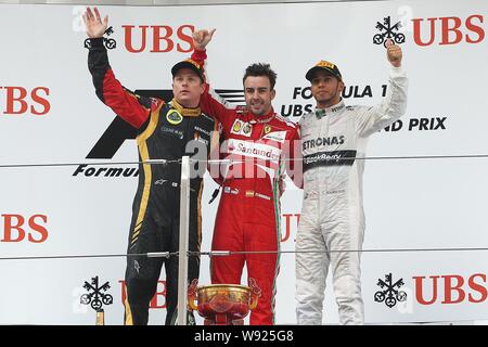 (Von links) Finnische F1 Fahrer Kimi Räikkönen von Lotus, Spanisch F1-Pilot Fernando Alonso von Ferrari und britischen F1-Pilot Lewis Hamilton Mercedes w Stockfoto