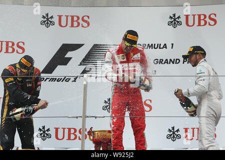 (Von links) Finnische F1 Fahrer Kimi Räikkönen von Lotus, Spanisch F1-Pilot Fernando Alonso von Ferrari und britischen F1-Pilot Lewis Hamilton Mercedes s Stockfoto