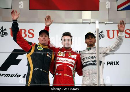 (Von links) Finnische F1 Fahrer Kimi Räikkönen von Lotus, Spanisch F1-Pilot Fernando Alonso von Ferrari und britischen F1-Pilot Lewis Hamilton Mercedes w Stockfoto