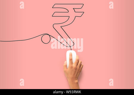 Menschliche Hand, die eine Computermaus und ihren Draht steuert, der Rupie-Symbol macht Stockfoto