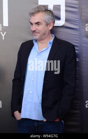 Mexikanischen Regisseur Alfonso Cuaron lächelt bei einer Pressekonferenz zur Premiere seines neuen Films, Schwerkraft, in Peking, China, 18. November 2013. Stockfoto