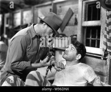 HARRY WOODS als Gefängniswärter und Paul Muni als James Allen, ICH BIN EIN FLÜCHTLING AUS EINER CHAIN GANG Direktor 1932 Mervyn LeRoy Buch Robert E. Verbrennungen Warner Bros. Stockfoto