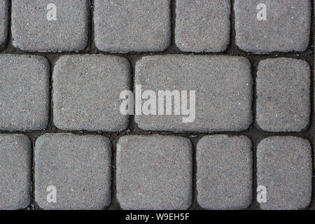Textur aus Beton oder cobble Grey Gehwegplatten oder Steine für Boden, Wand oder Pfad. Traditionelle Zaun, Gericht, Hinterhof oder den Weg ebnet. Stockfoto