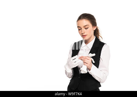 Junge Kellnerin in formalen tragen weiße Handschuhe isoliert auf weißem suchen Stockfoto