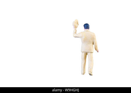 In der Nähe des Miniatur Menschen mit Beschneidungspfaden auf weißem Hintergrund. Stockfoto
