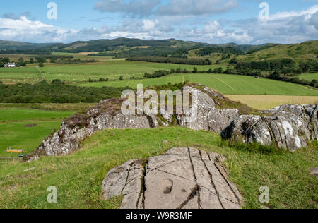 Die geschnitzten footprint Dunadd hillfort, Kilmartin Glen, Argyll und Bute, Schottland, Stockfoto