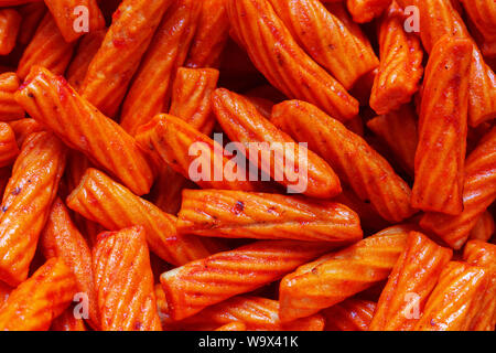 Zusammenfassung Hintergrund Schließen Sie herauf köstlich würzigen roten Snack Textur Stockfoto