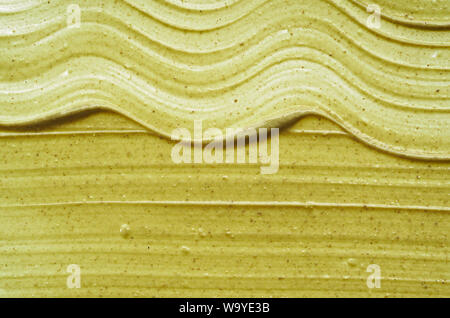 Textur und Anschläge einer Hellgrün organische Maske für Gesicht oder Körper Creme auf weißem Hintergrund Stockfoto