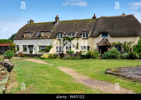 Cottages am Kai in Porlock Wehr, in der Nähe von MInehead, Someset Stockfoto