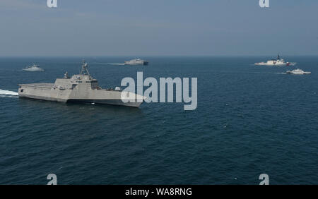 A U.S. Coast Guard Cutter Stratton (WMSL 752), Right, Beside Philippine ...