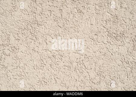 Beige Stuck Wand, Textur Detail Nahaufnahme. Stockfoto