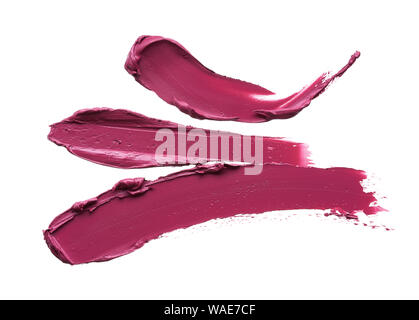 Die Abstriche und die Textur von Burgund Farbe Lippenstift oder Acrylfarbe auf weißem Hintergrund Stockfoto