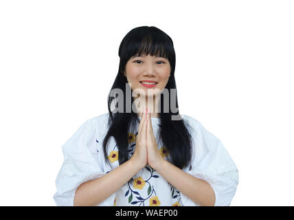 Cute Asian Girl Respekt oder Betteln mit Lächeln. auf weißem Hintergrund. Stockfoto