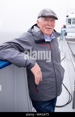 15. August 2019, Schleswig-Holstein, Hörnum (Sylt): Detlef Hansen, Leiter des Nationalparks Wattenmeer, auf einer Presseveranstaltung in einer Muschel Cutter im Wattenmeer aus Hörnum auf Sylt. Foto: Christian Charisius/dpa Stockfoto