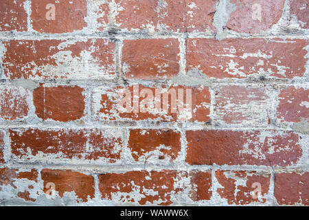 Retro Red brick wall mit Peeling weiße Farbe Hintergrund Textur closeup Stockfoto