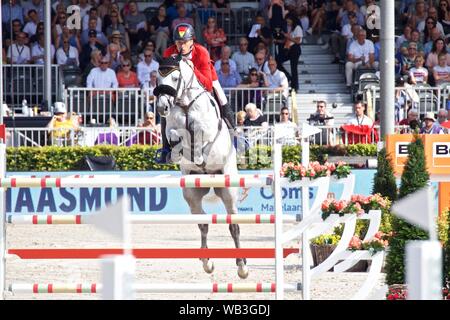 Rotterdam, die Niederlande. 23 Aug, 2019. Die Deutschen Christian Ahlmann auf Clintrexo Z führt während der FEI Jumping Europameisterschaft in Rotterdam, Niederlande, 23.08.2019. Quelle: Sylvia Lederer/Xinhua/Alamy leben Nachrichten Stockfoto