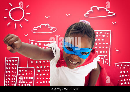 Kind wirkt wie ein Superheld der Welt auf rotem Hintergrund zu speichern. Stockfoto