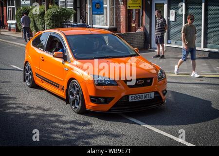 2007 orange Ford Focus ST-3 bei der Ormskirk Motorfest in Lancashire, Großbritannien Stockfoto