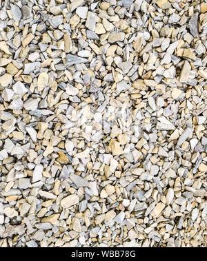Hintergrund aus kleinen runden Schotter. Ein Haufen von kleinen Pellets. Stockfoto