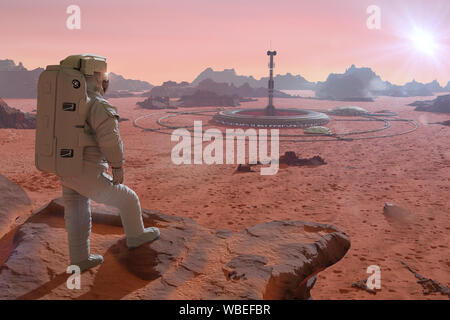 Astronaut auf dem Planeten Mars, auf einer Basis in die Wüste Landschaft suchen Stockfoto