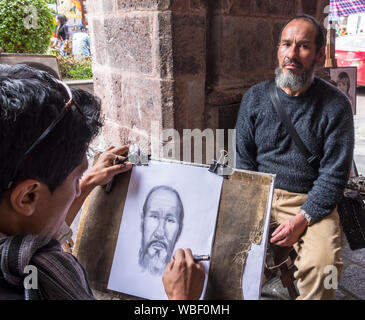 Ambato, Ecuador - Mar 15, 2015 - Street Artist zeichnet Porträt des Menschen Stockfoto