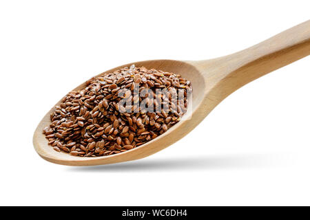 Ganze Leinsamen in einem Löffel aus Holz. Gesunde Lebensmittel für Cholesterin senken und Prävention von Herzkrankheiten und Krebs. Isklated auf weißem Hintergrund. Stockfoto