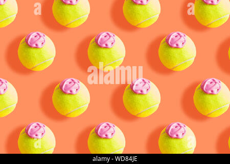 Tennis ball Pattern mit rosa Farbe - Eis Imitation - auf orange Coral abstrakt Hintergrund Stockfoto