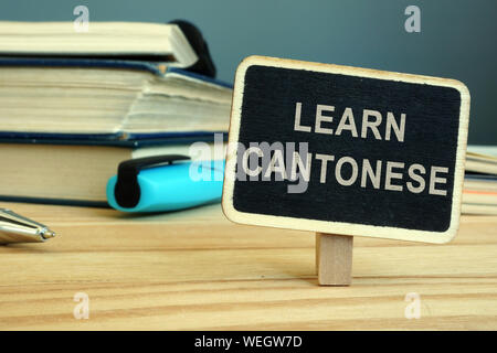 Kantonesische Sprache Konzept Lernen. Buch und Notebooks. Stockfoto