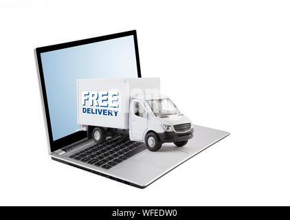 Kostenlose Lieferung cargo Truck auf Laptop auf weißem Hintergrund Stockfoto