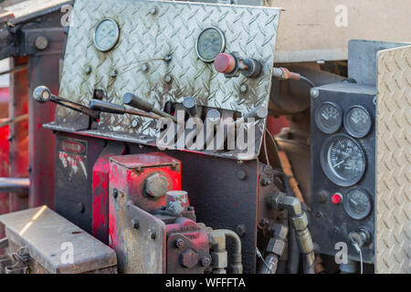 detail image of a well used control panel on a piece of machinery with knobs, gauges and levers Stockfoto