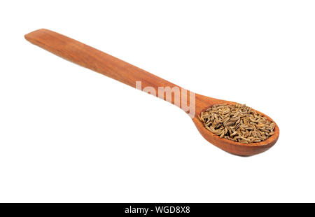 Gewürz trocknen Kümmel in Holzlöffel closeup auf weißem Hintergrund Stockfoto